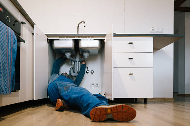 Professional Emergency Plumber technician working in Stigler, OK